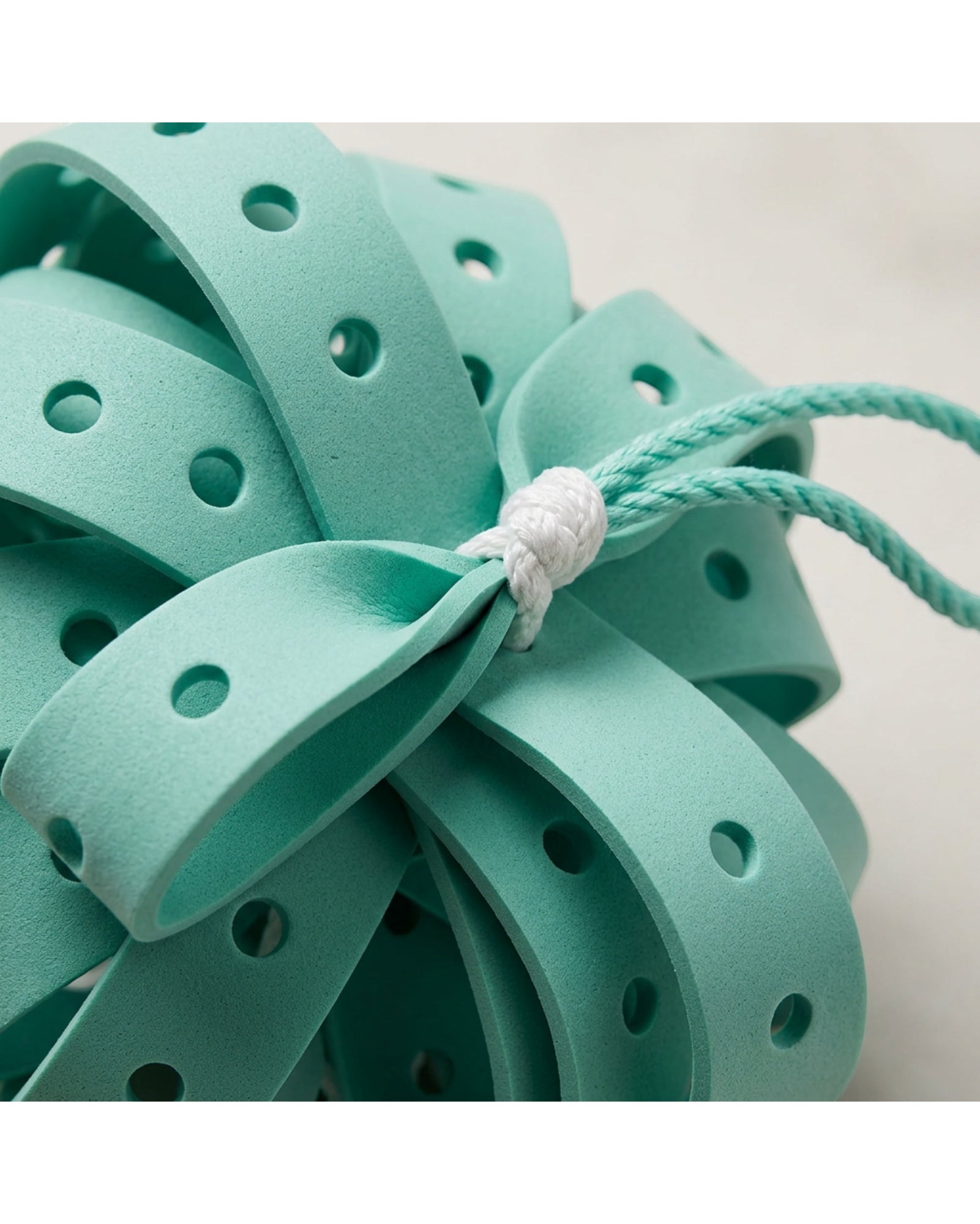 Rgdwn Perforated EVA Ribbon Bath Ball Seafoam - Detail view